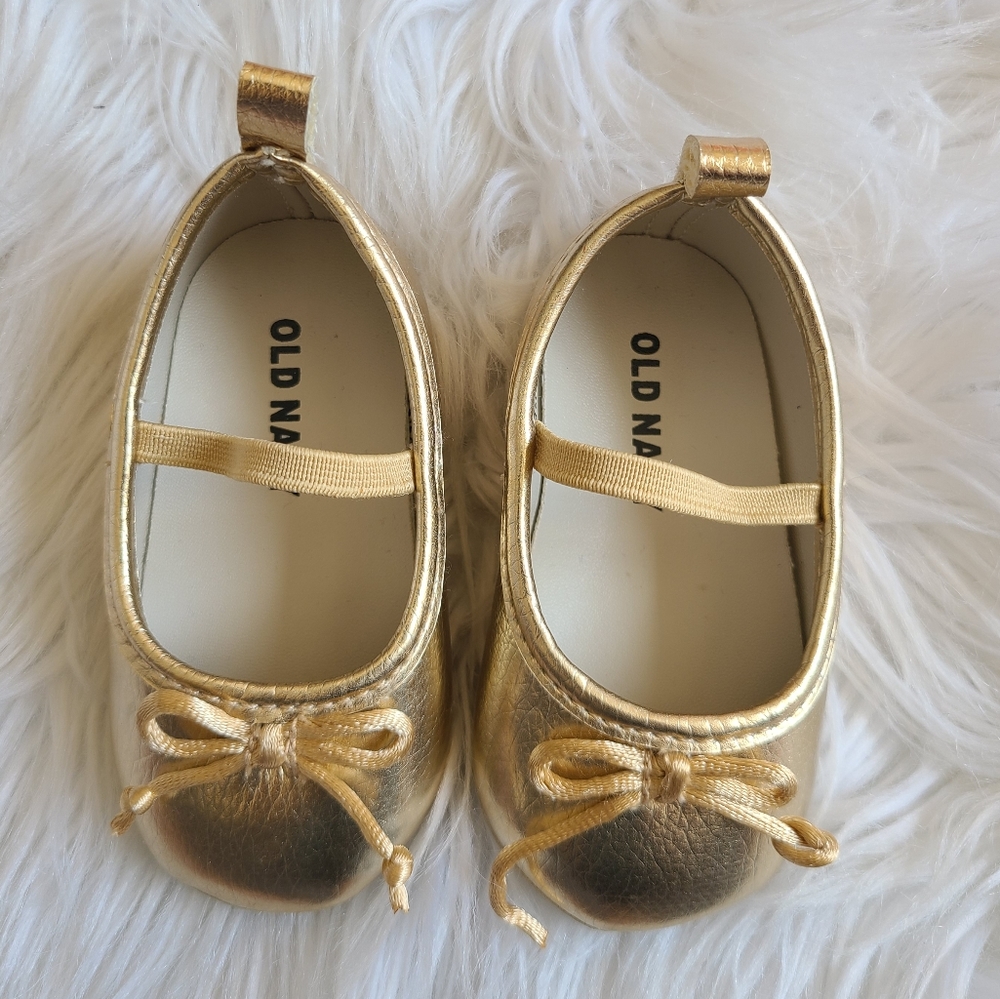 Gold baby shoes